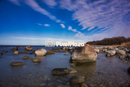 Rocky Baltic Sea Coastline Under a Dramatic Sky